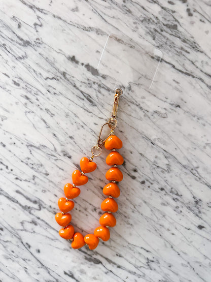 Telefoonkoord met hartjes oranje