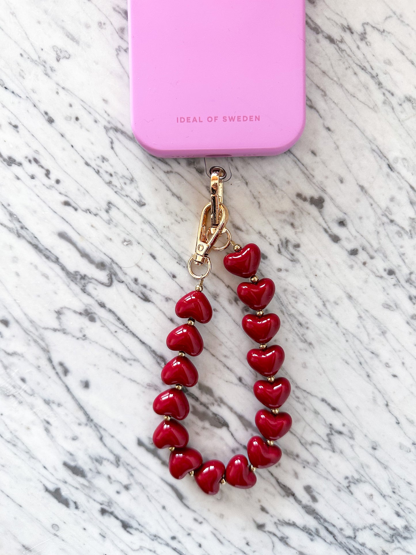 Telefoonkoord met hartjes bordeaux